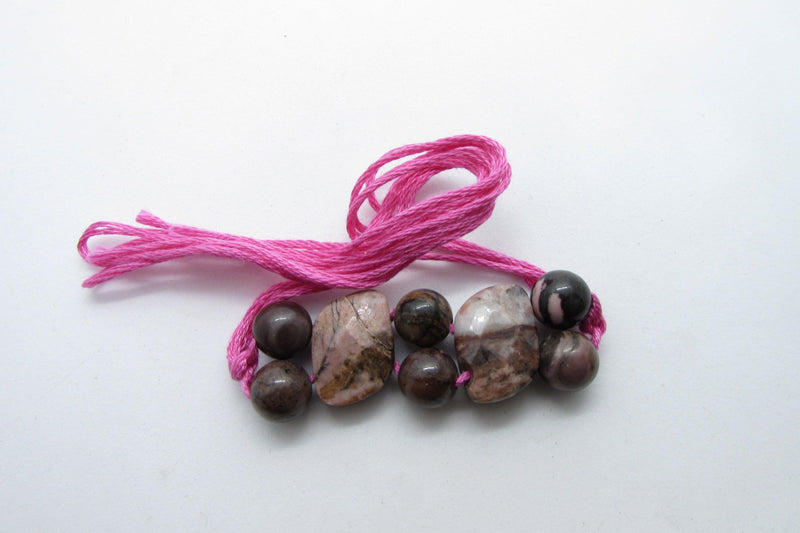 Rhodonite Rakhi: Embrace Compassion and Balance | Brahmatells - BrahmatellsStore