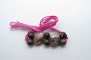 Rhodonite Rakhi: Embrace Compassion and Balance | Brahmatells - BrahmatellsStore